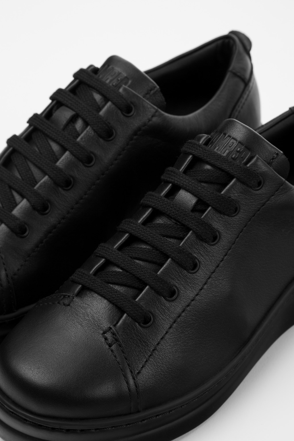 Runner Up Black Leather Sneakers for Women.