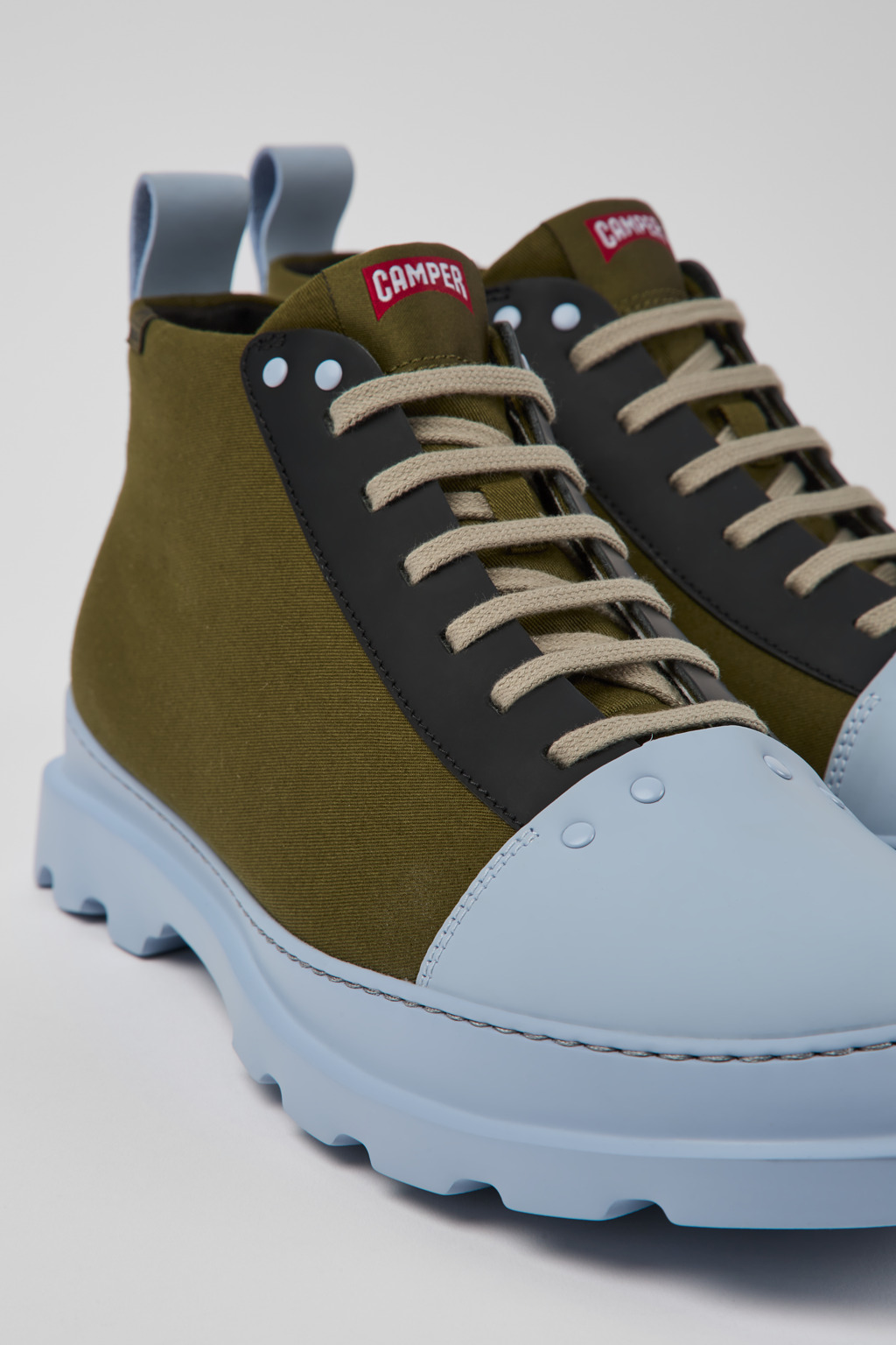 Brutus Green, blue, and black shoes for men