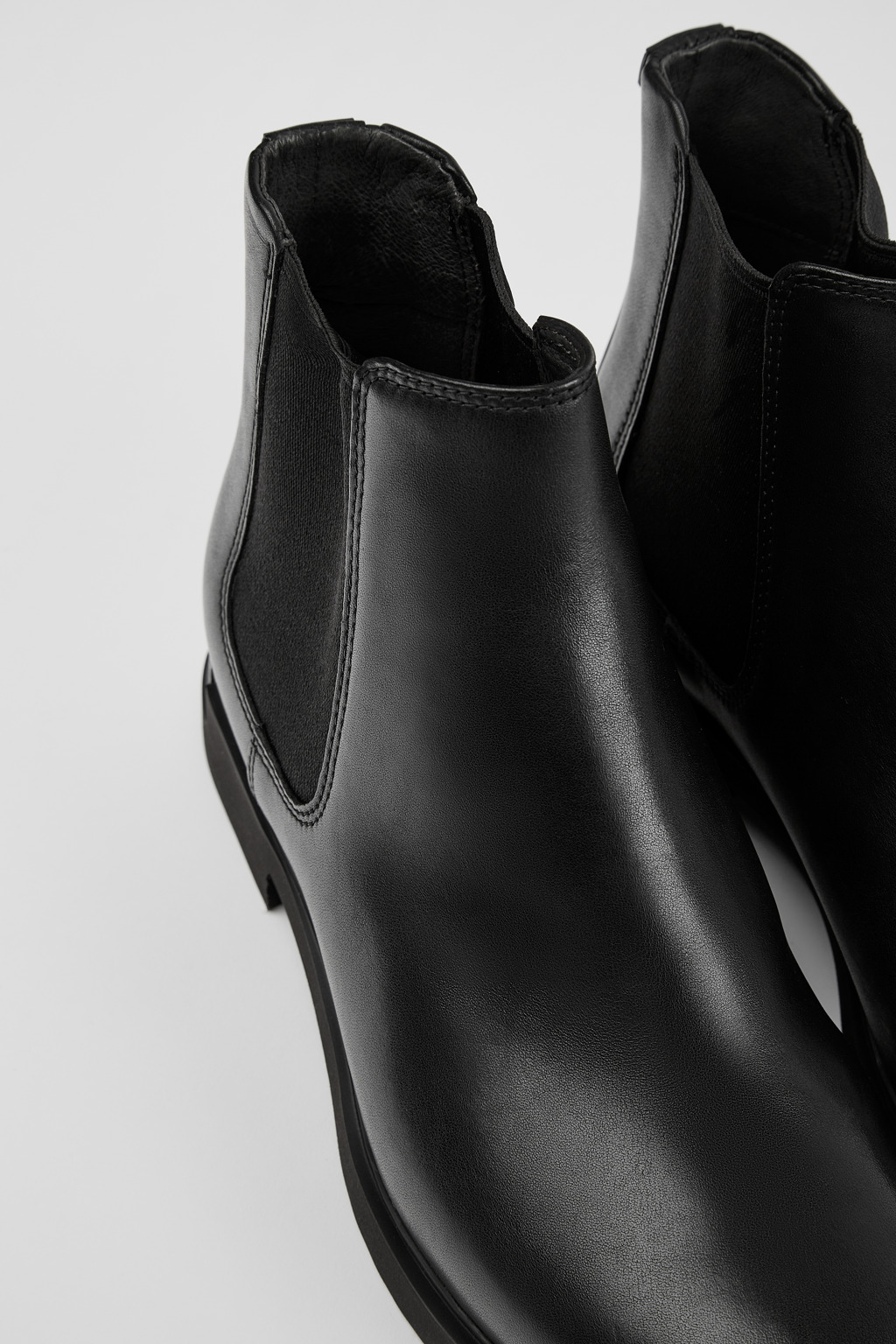 Iman Black Leather Ankle Boots for Women.